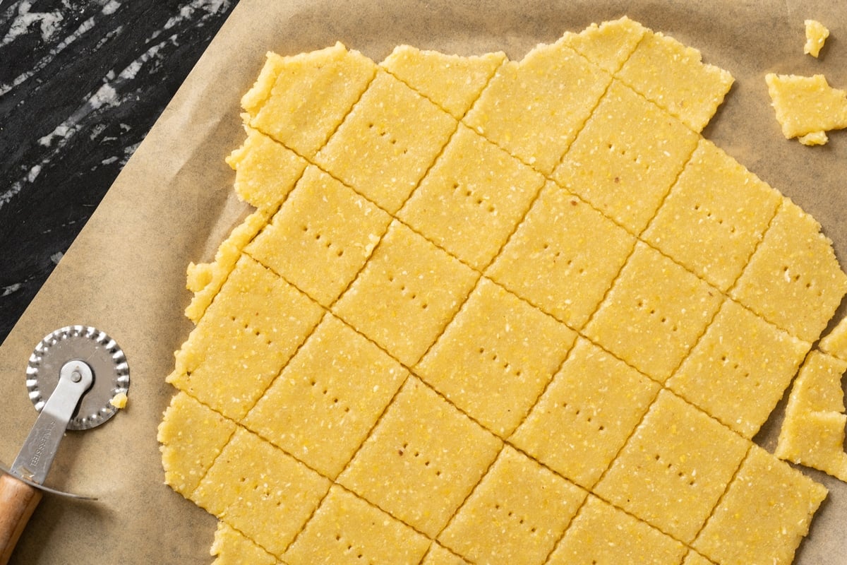 Unbaked rolled and trimmed homemade cornbread cracker