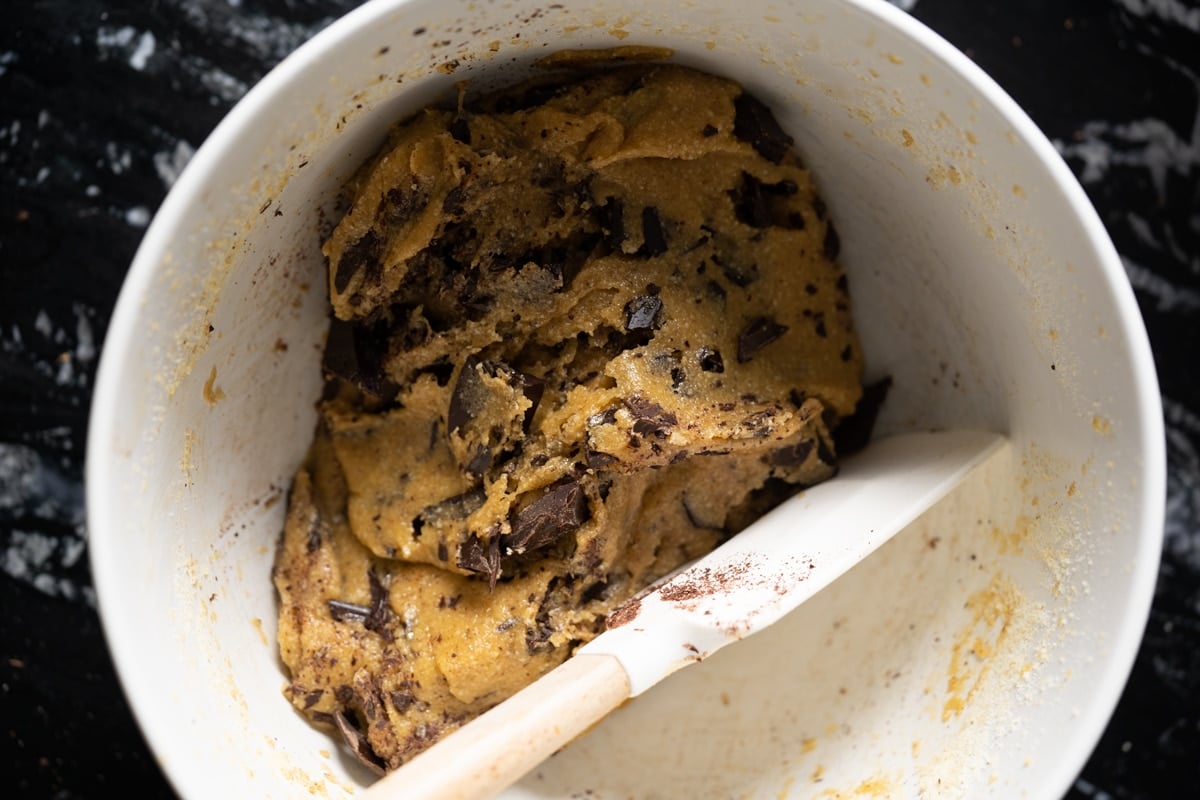 Brown butter keto cookie dough in a white mixing bowl