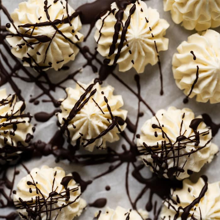 Buttercream keto fat bombs drizzled with chocolate
