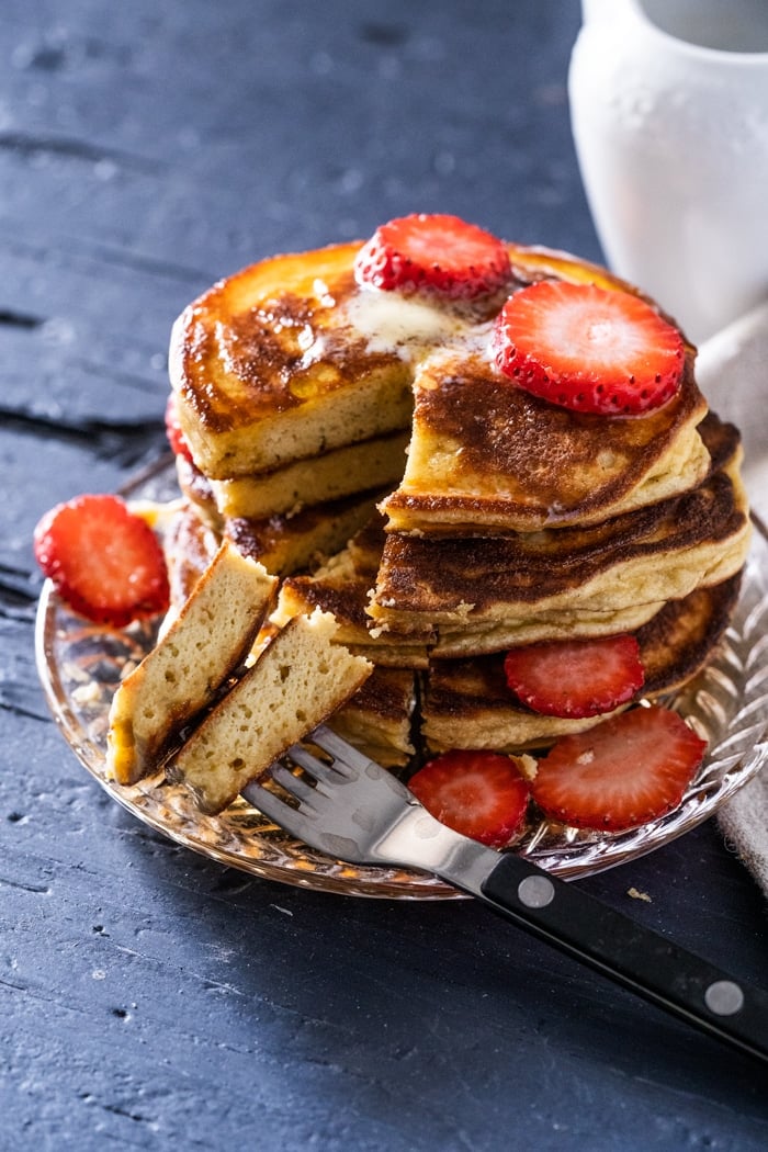 Cut into keto pancakes showing a fluffy texture