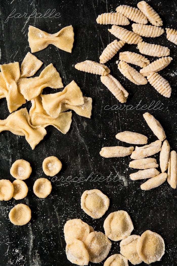 The different shapes of keto pasta on a black marble surface