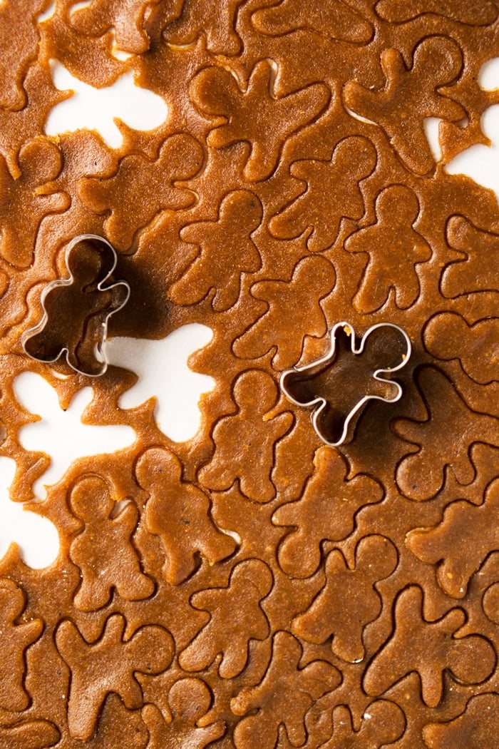 Cutting out mini keto gingerbread cookies