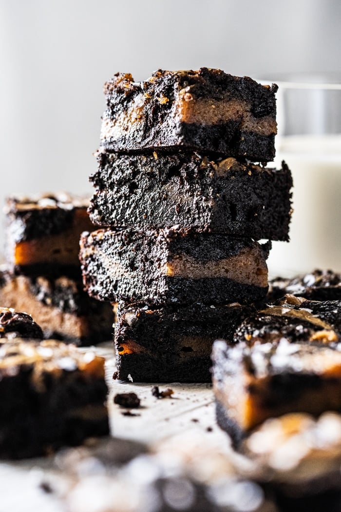 Stacked keto peanut butter brownies with a glass of milk