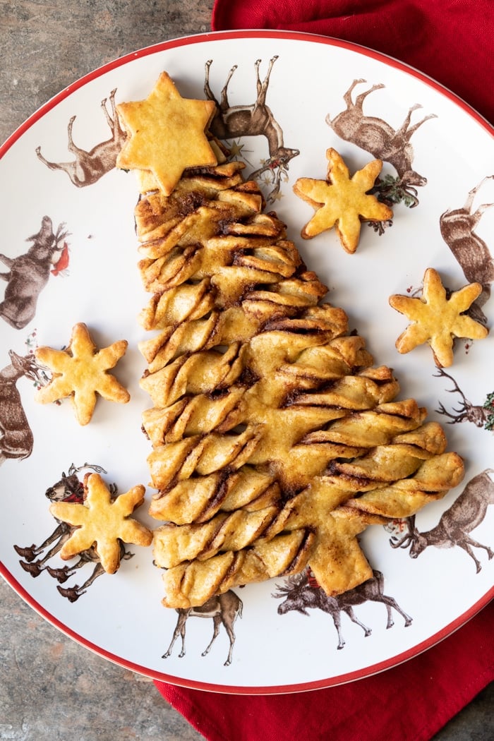 Keto pull-apart cinnamon roll Christmas Tree on a festive plate