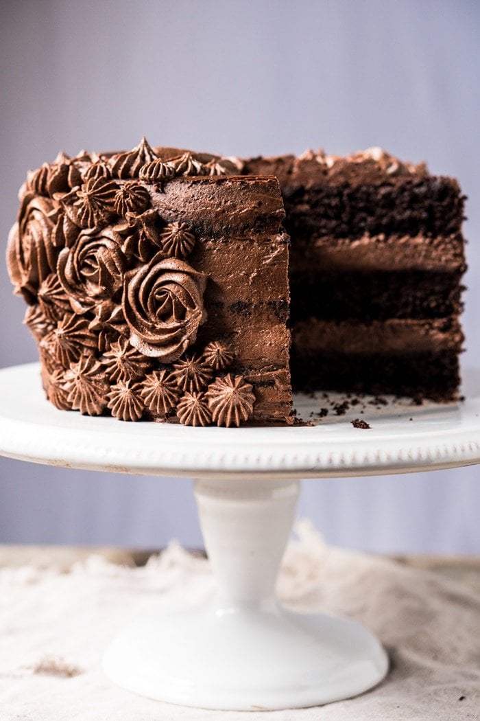 Sliced paleo & keto chocolate cake with cream cheese buttercream frosting