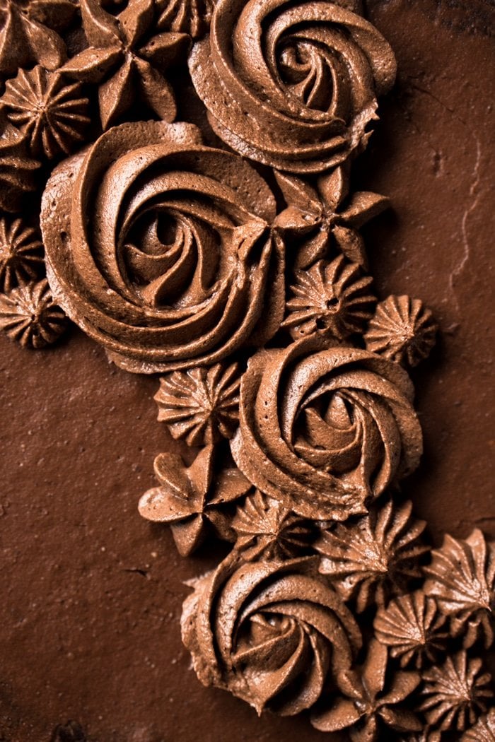 Closeup of chocolate buttercream flowers on a keto chocolate cake