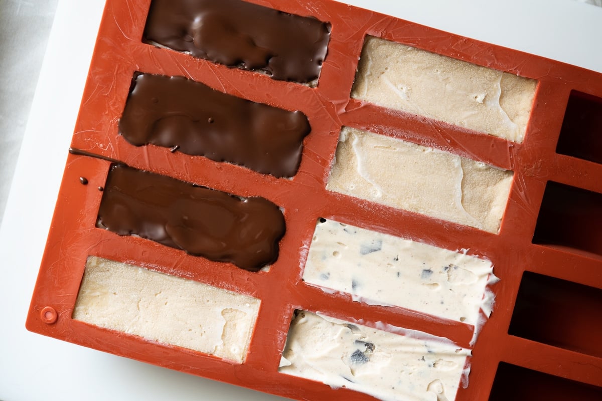 Using a silicon candy bar mould to build the healthy snickers layers