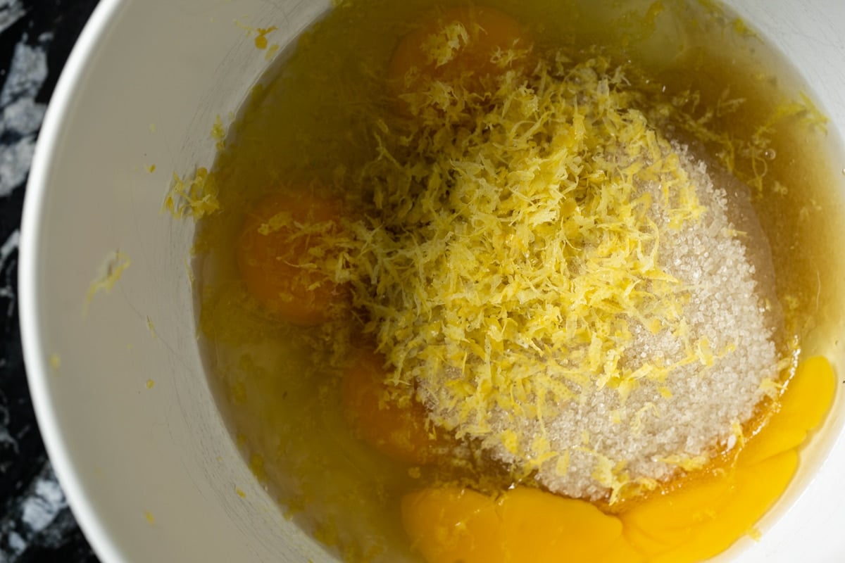 Ingredients for the keto lemon pound cake in a white mixing bowl