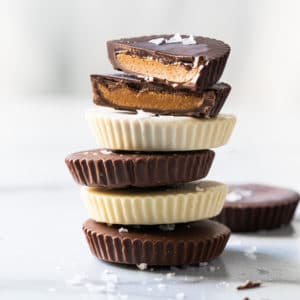 Stack of keto peanut butter cups with flaky sea salt