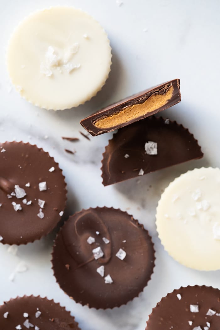 Keto peanut butter cups on a marble surface