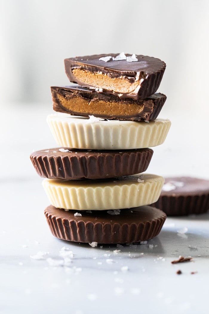 Stack of keto peanut butter cups (with white, milk and dark chocolate!)