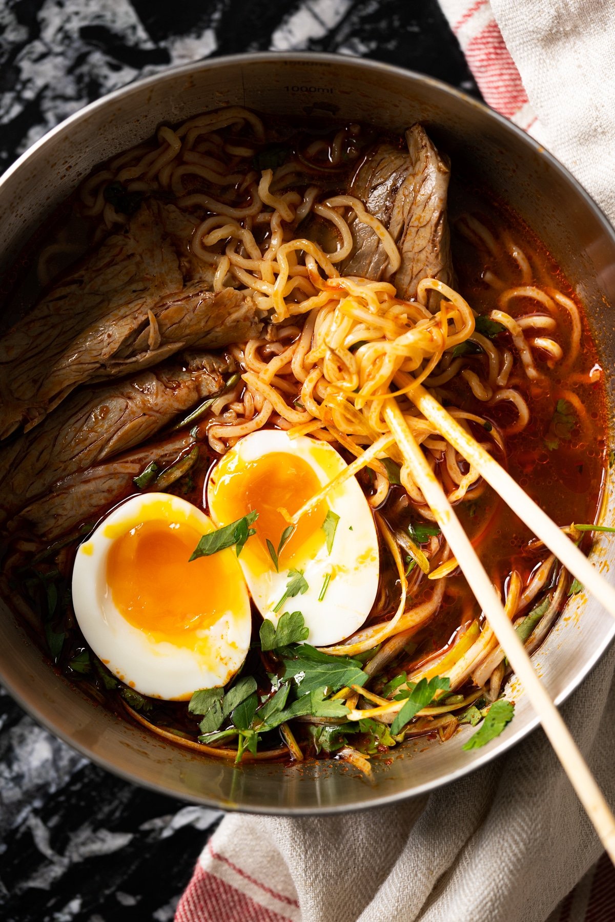Eating keto ramen with shirataki noodles, beef and a soft boiled egg