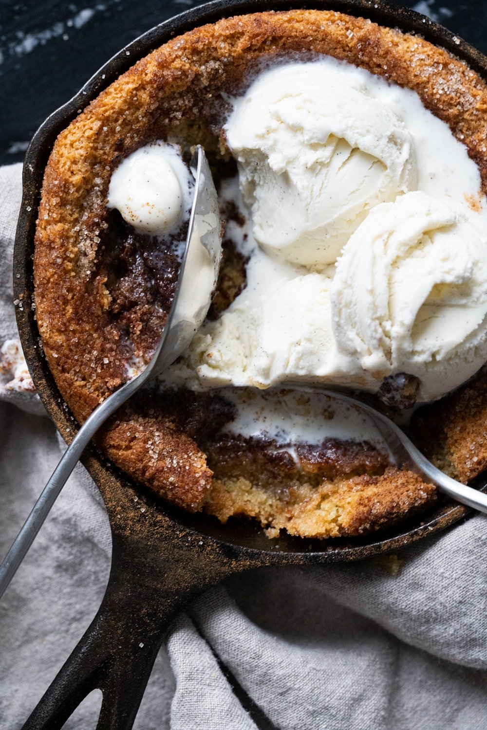 Sharing a keto snickerdoodle skillet cookie with two spoons