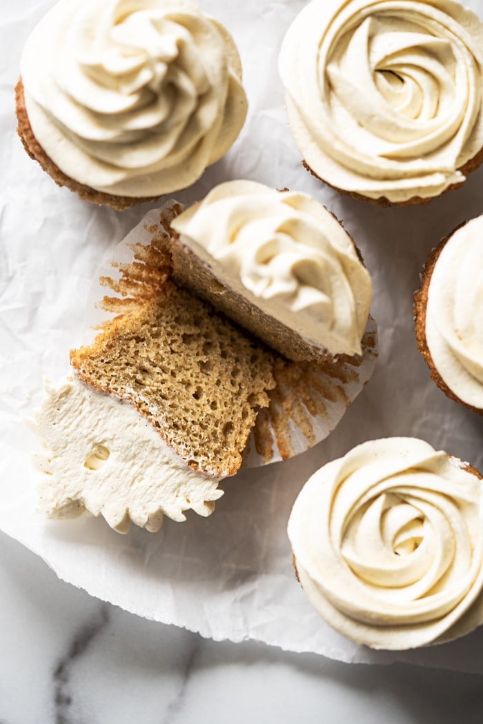 Halved keto vanilla cupcake showing fluffy texture