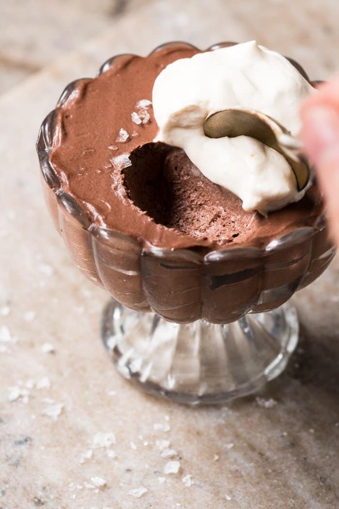 Taking a spoonful of keto chocolate mousse