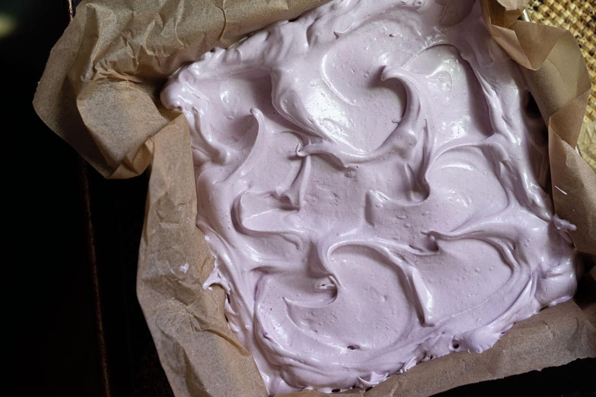 Freshly whipped grape marshmallows with a glossy sheen