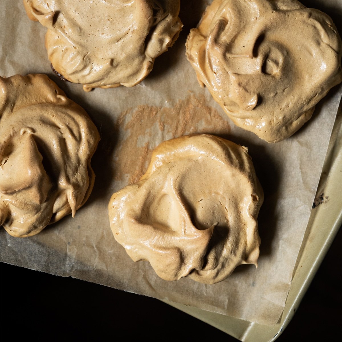 Freshly baked maple meringues on a baking tray