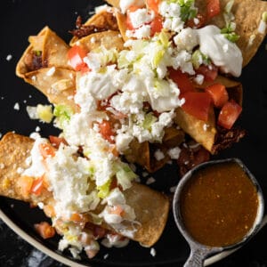 Mexican chicken taquitos (i.e. flautas!) topped off with lettuce, cream, cheese and salsa