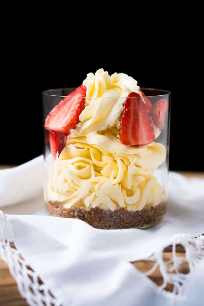 No bake Keto cheesecake with strawberry slices in a clear glass