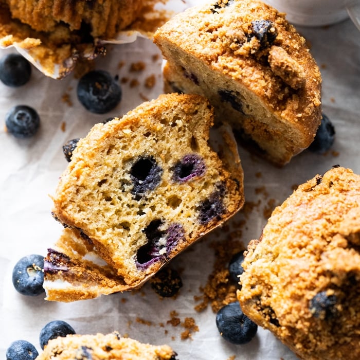 Halved keto blueberry muffin with almond streusel
