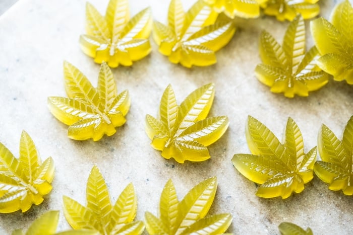 Green keto CBD gummies in cannabis leaf shape