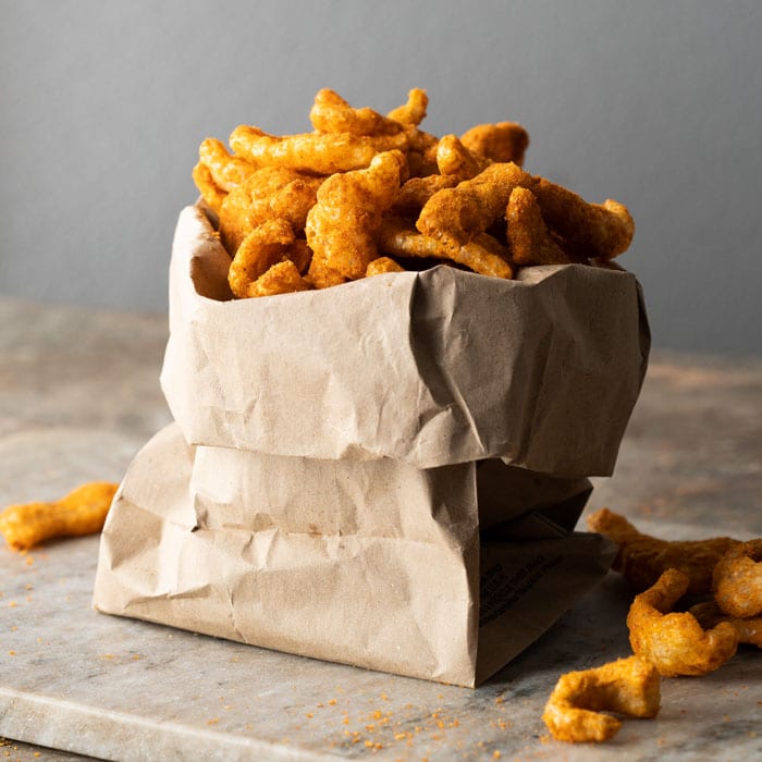Paleo & keto cheetos in a brown paper bag