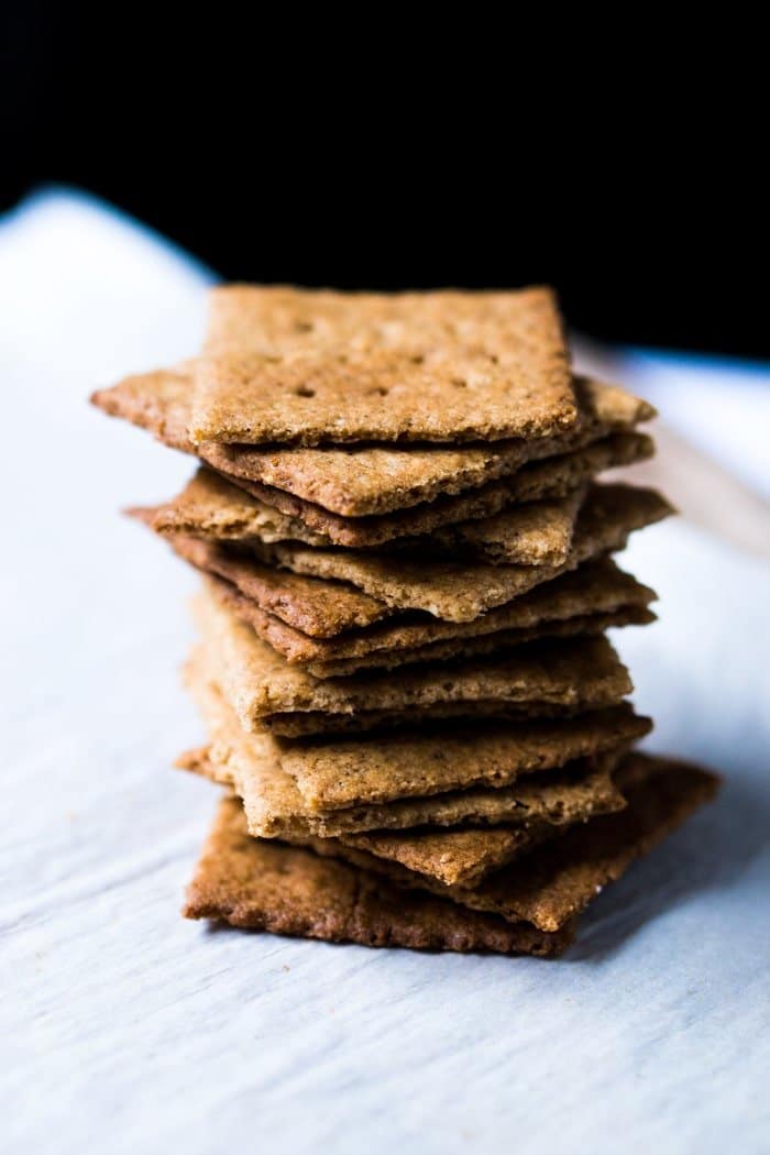 A pile of Keto Graham crackers with a black background