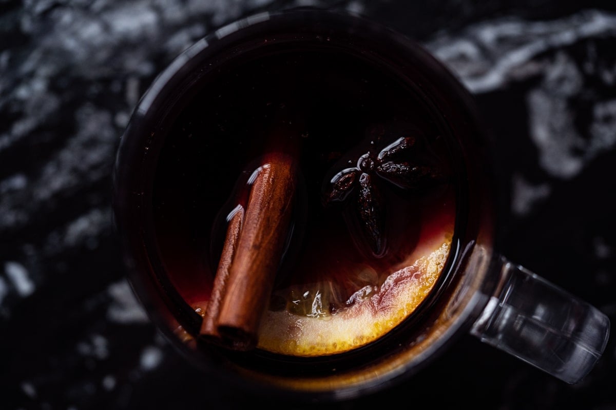 Overhead shot of a mug with keto mulled wine, orange and spices