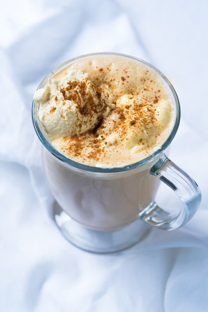 Paleo & keto pumpkin spice latte in a glass mug with whipped cream