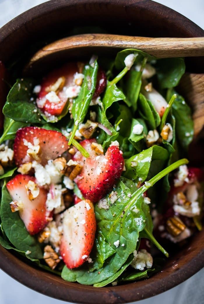 Keto strawberry salad in a wooden salad bowl