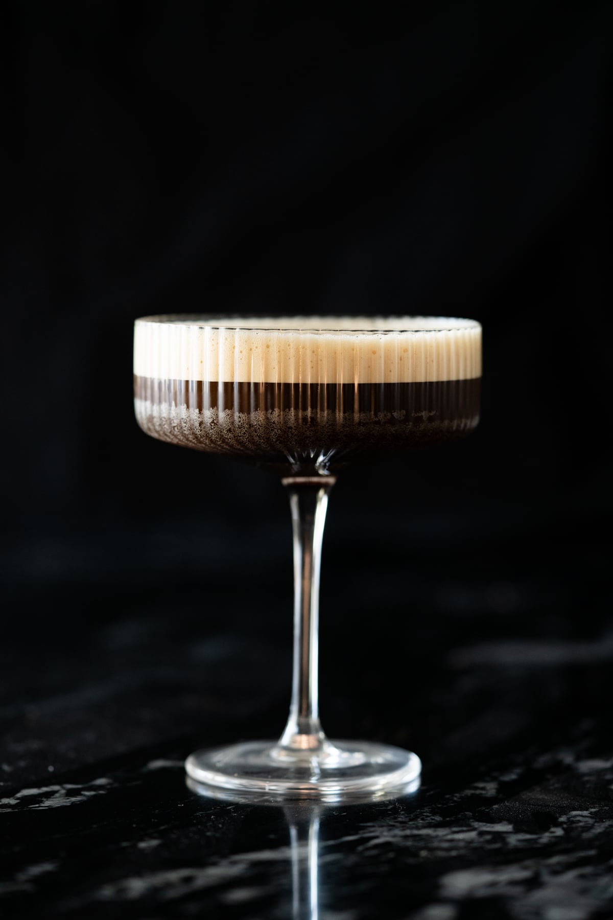 Side shot of sugar free espresso martini showing the frothy head