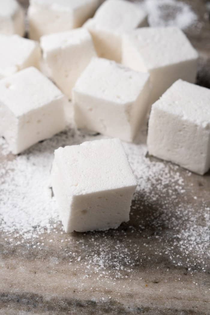 Dusted keto marshmallows on marble